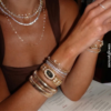 11_-_2026-04-19T230744.702.png Elegant Gold Bangle Watch ?C Black Mother of Pearl Oval Dial for Women