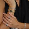 Elegant Gold Bangle Watch ?C Black Mother of Pearl Oval Dial for Women
