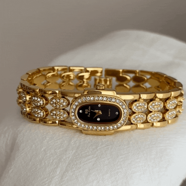 oval_dial_gold_bracelet_watch.gif Elegant Gold Bangle Watch ?C Black Mother of Pearl Oval Dial for Women